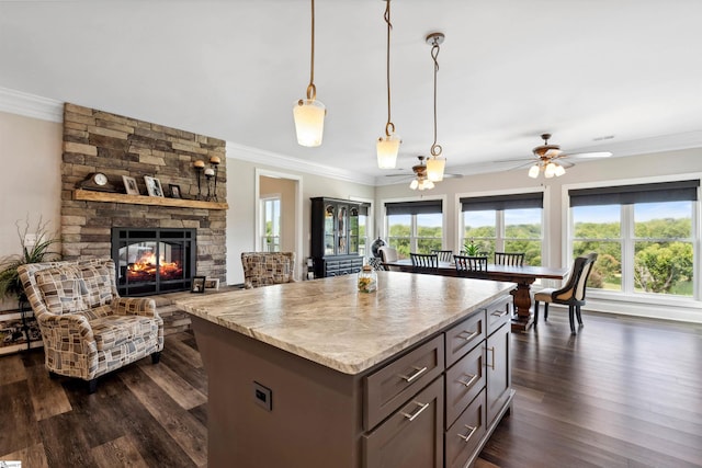 3560 Pelzer Hwy, Easley, SC 29642 - kitchen featuring ornamental molding, open floor plan, dark wood-type flooring, hanging light fixtures, and a center island