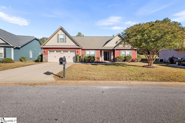 view of front facade with a front yard and a garage