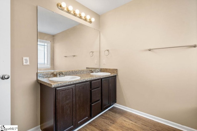 bathroom with vanity and hardwood / wood-style flooring