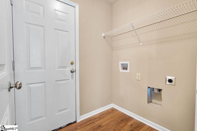 laundry room with hookup for an electric dryer, hardwood / wood-style floors, and washer hookup