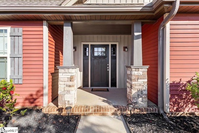 doorway to property with a porch