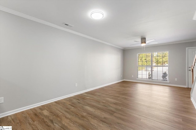 spare room featuring ornamental molding, hardwood / wood-style floors, and ceiling fan