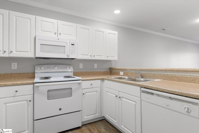 kitchen featuring dark wood-type flooring, ornamental molding, sink, white cabinets, and white appliances