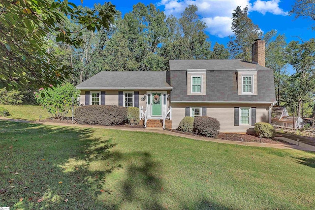 tri-level home featuring a front yard