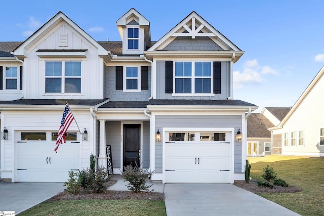 view of front facade with a garage and a front lawn