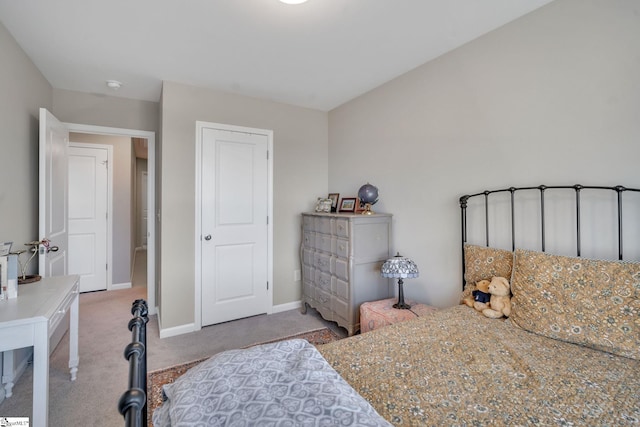 bedroom featuring light carpet