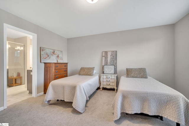 carpeted bedroom featuring ensuite bathroom