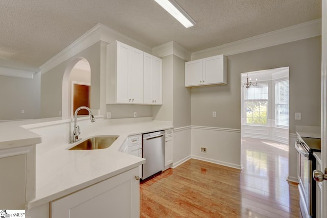 kitchen with sink, white cabinetry, appliances with stainless steel finishes, a textured ceiling, and light hardwood / wood-style floors