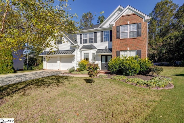 view of front of property with a front lawn and a garage