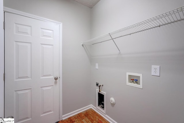 clothes washing area with hookup for an electric dryer, gas dryer hookup, and washer hookup