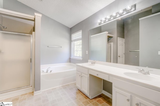 bathroom with vanity, shower with separate bathtub, a textured ceiling, and lofted ceiling