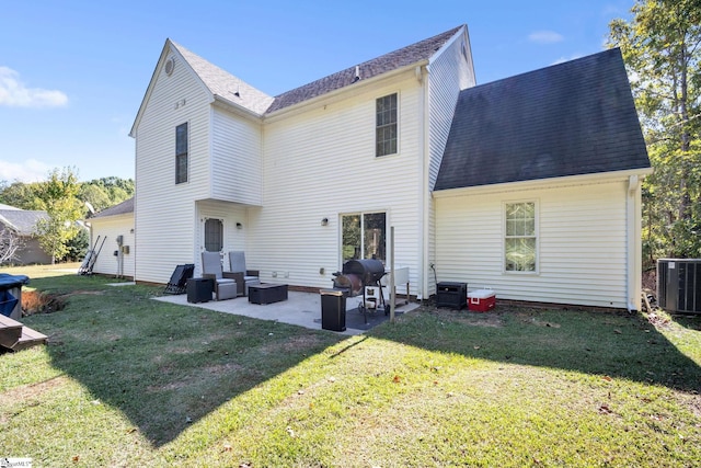 back of property with central AC, an outdoor hangout area, a patio, and a lawn