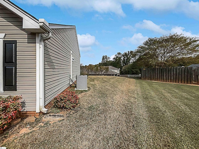 view of yard with central AC