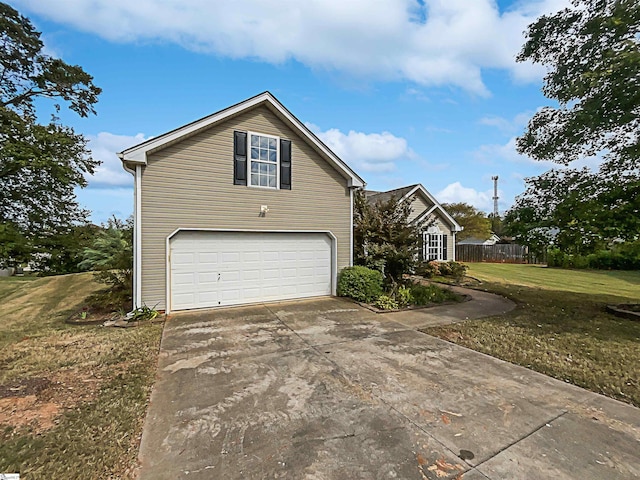 view of property exterior with a garage and a lawn