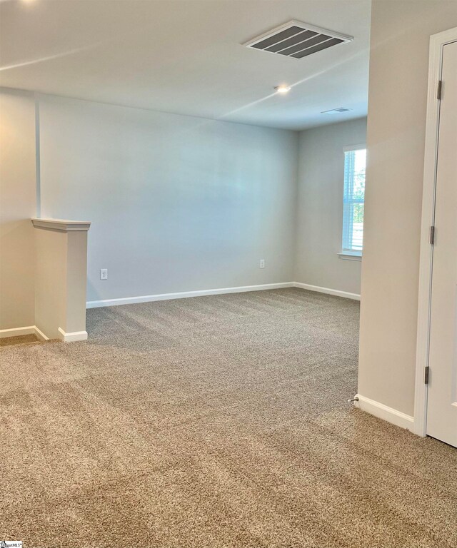 unfurnished room with carpet floors