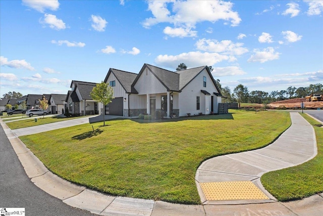 view of front facade featuring a front yard and a garage