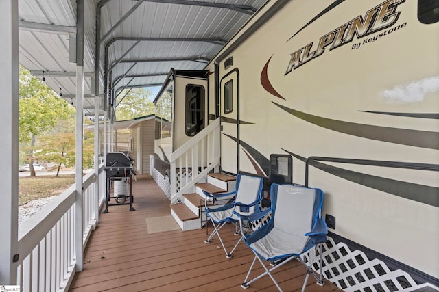 wooden terrace featuring grilling area