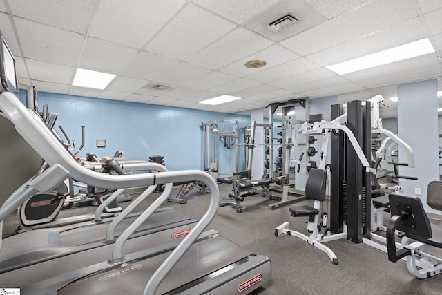 workout area with a drop ceiling