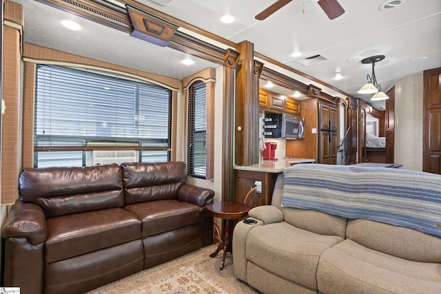 interior space featuring ceiling fan