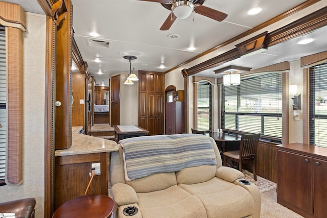 bedroom with ceiling fan and ornamental molding