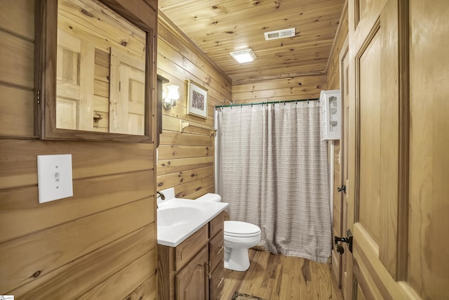 304 Cliff Ridge Dr, Cleveland, SC 29635 - full bathroom featuring wooden walls, wood finished floors, visible vents, toilet, and vanity
