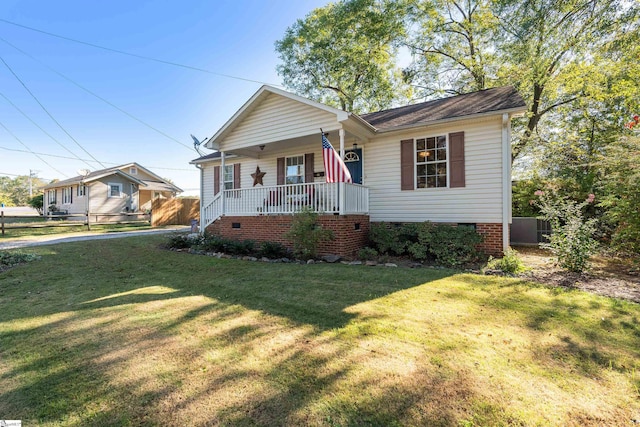 view of front facade featuring a front lawn and covered porch