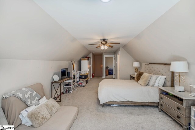 carpeted bedroom with ceiling fan and lofted ceiling