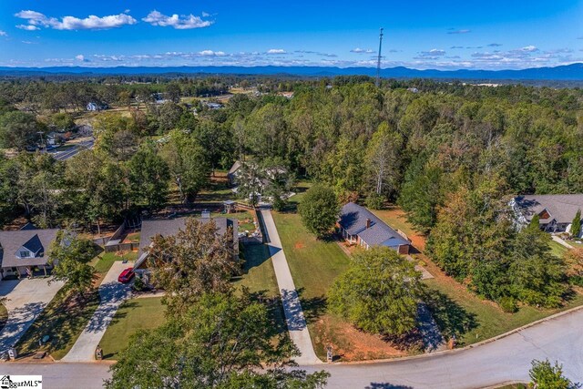 birds eye view of property with a mountain view