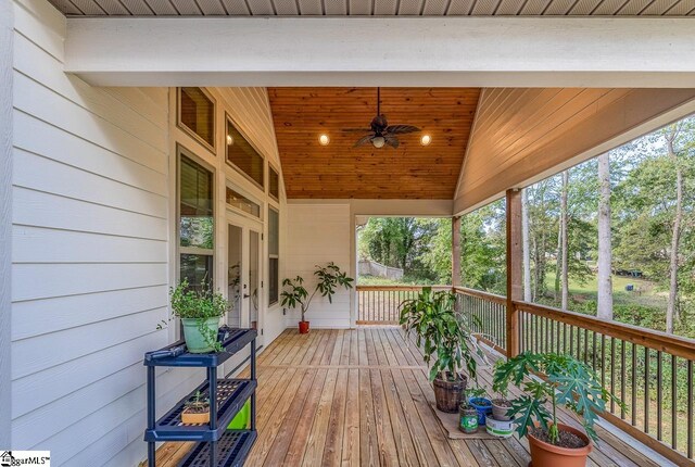 wooden terrace featuring ceiling fan