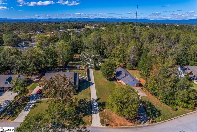 birds eye view of property featuring a mountain view