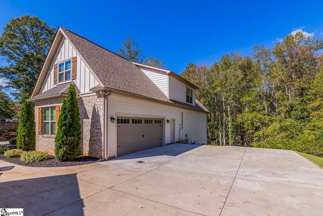 view of side of property featuring a garage