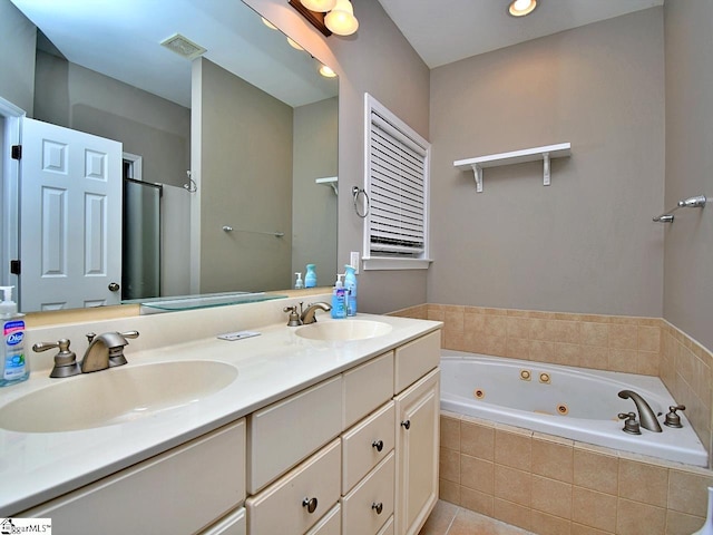 bathroom with vanity, independent shower and bath, and tile patterned flooring