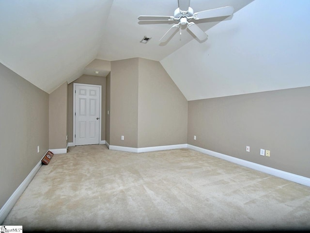 bonus room with lofted ceiling, light colored carpet, and ceiling fan