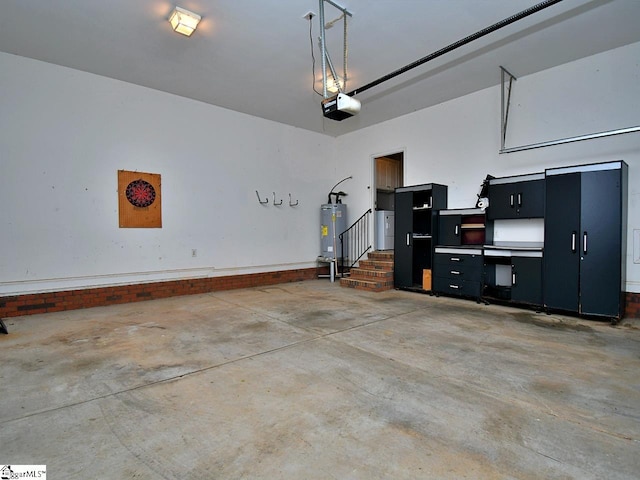 garage with a garage door opener and water heater