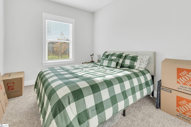 bedroom with light colored carpet