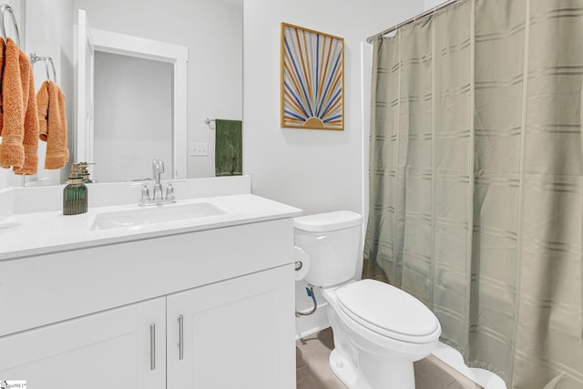 bathroom with vanity, a shower with shower curtain, toilet, and tile patterned flooring