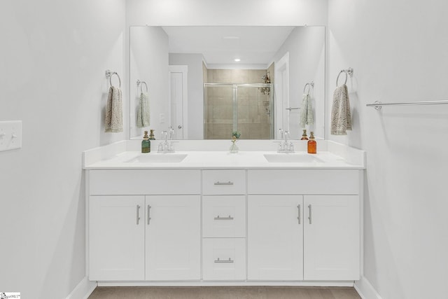 26 Shorncliffe Rd, Simpsonville, SC 29680 - full bathroom with double vanity, a shower stall, baseboards, and a sink
