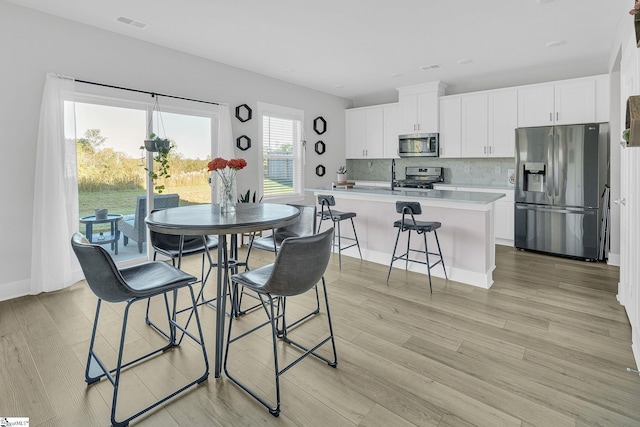 dining room featuring light hardwood / wood-style floors