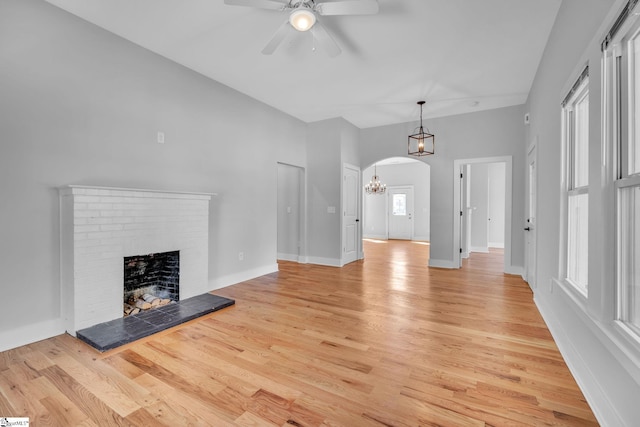 unfurnished living room featuring light hardwood / wood-style flooring and plenty of natural light