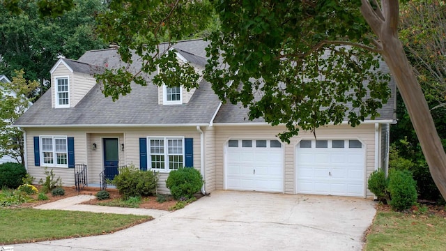 cape cod house with concrete driveway, roof with shingles, and an attached garage