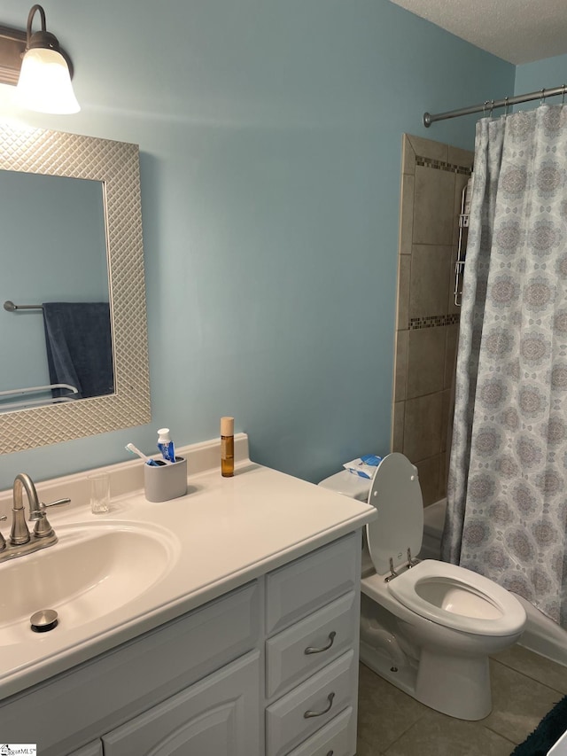 bathroom with toilet, walk in shower, vanity, and tile patterned floors