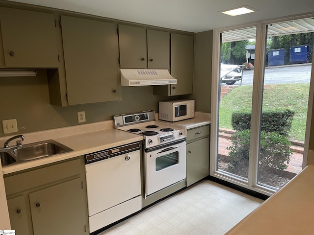 kitchen featuring sink and white appliances