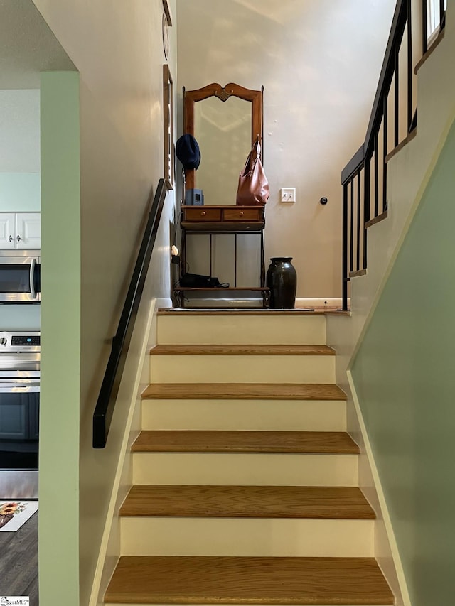 stairs with wood-type flooring