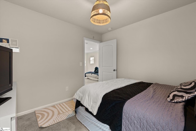 bedroom featuring light colored carpet