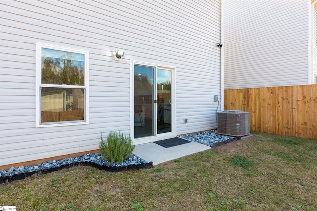 entrance to property with a yard