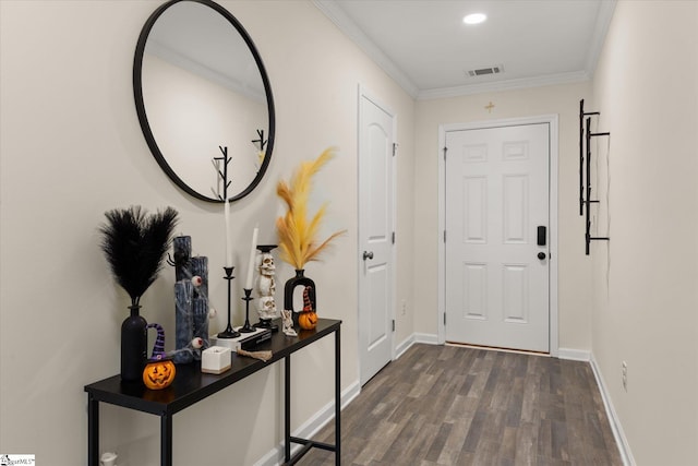 entryway with crown molding and dark hardwood / wood-style floors