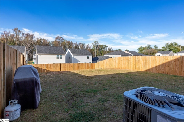 view of yard with central AC unit