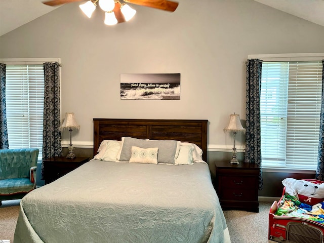 carpeted bedroom with vaulted ceiling and ceiling fan