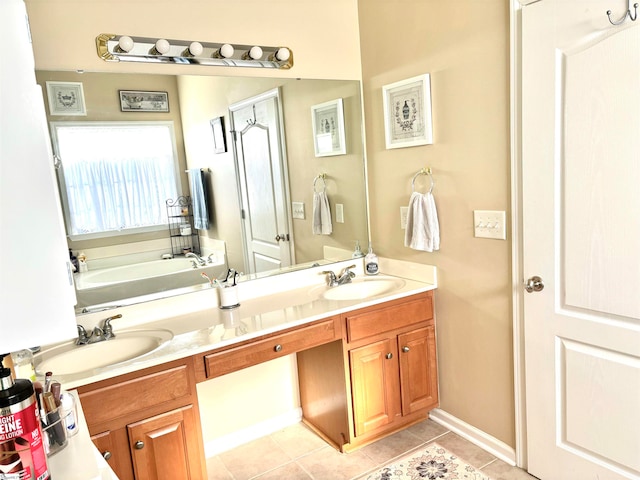 bathroom featuring vanity, tile patterned floors, and a bathing tub