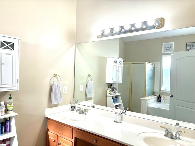 bathroom with vanity and separate shower and tub